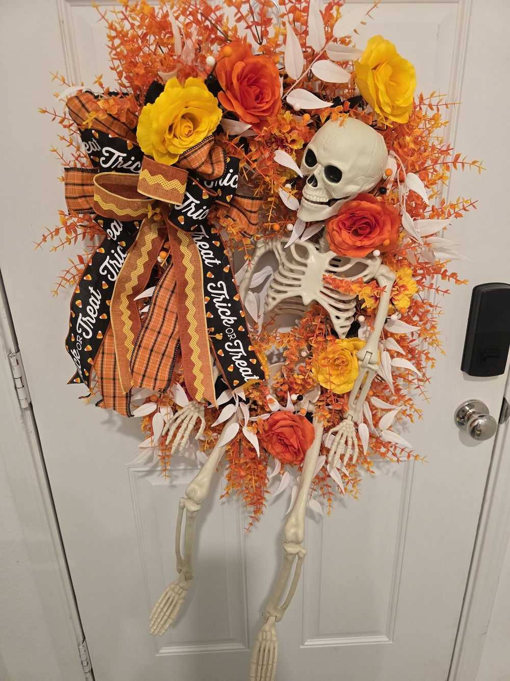 W043 - Halloween Skeleton Wreath with Orange & Yellow Flowers Candy Corn